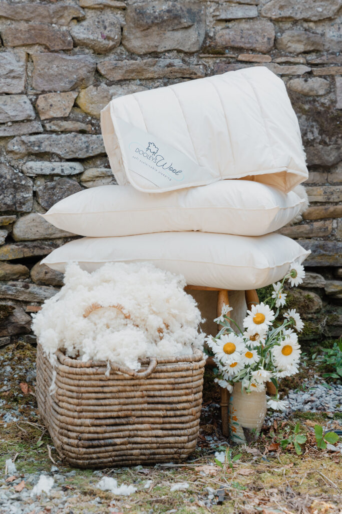 wool duvet and pillow set with raw wool and flowers