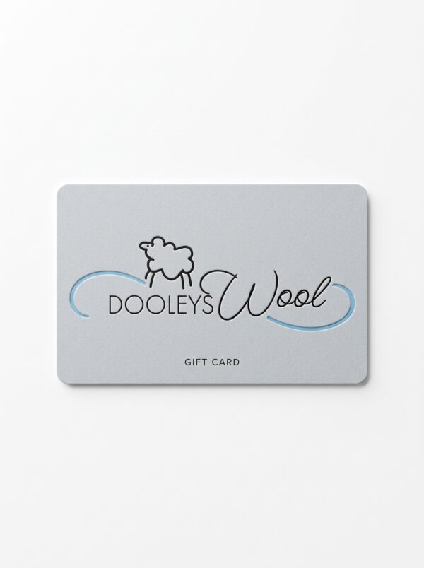 A luxurious light grey wool bedding gift card with the Dooley's Wool logo on it on a white background